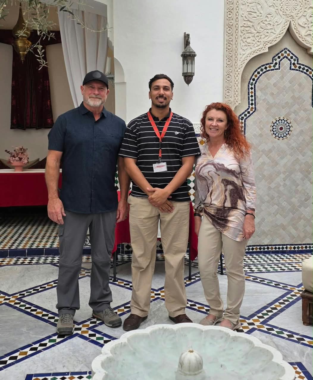 mohamed diyab picking up two travllers in a riad in medina of marrakech