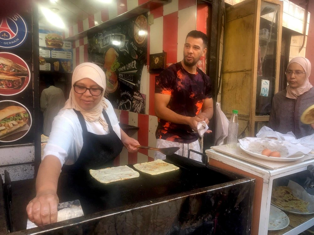 Msemen pancakes on a griddle on a Marrakech food tour